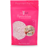 Pink packaging of Sprinkles with a gold label on a white background